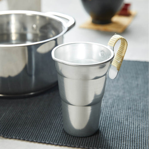 Aluminum Chirori Sake Warmer, on a table