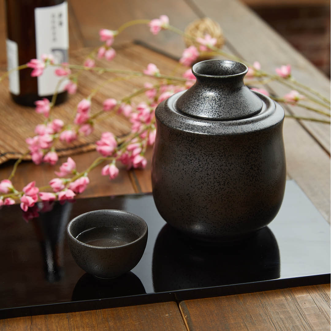 Black Round Guinomi Cup, on a table
