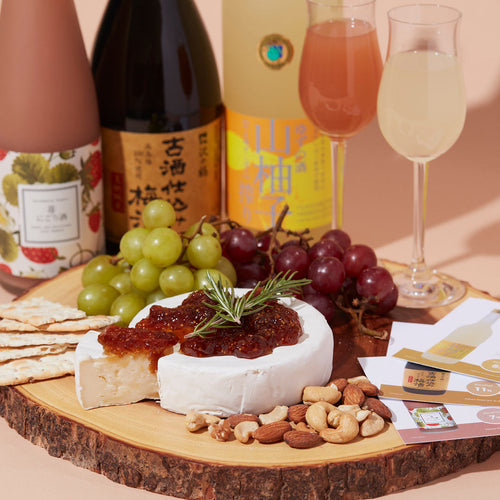 Sawanotsuru “Plum Sake,” Homare “Strawberry” flavored nigori and Tsukasabotan “Yuzu” flavored with dessert glasses, served with brie cheese, grapes and crackers